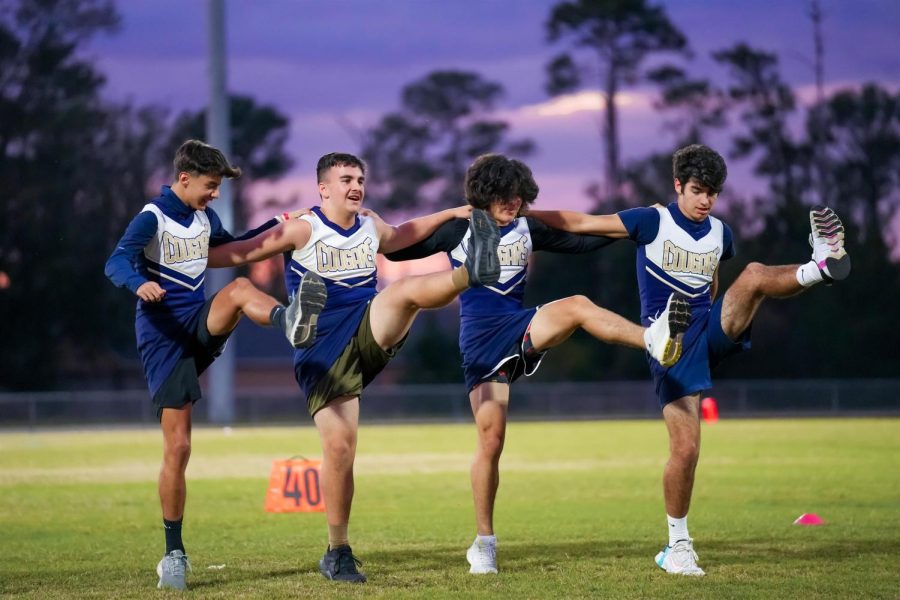 Joseph Healing (second from the left) dances alongside the rest of the Powderpuff cheerleaders.