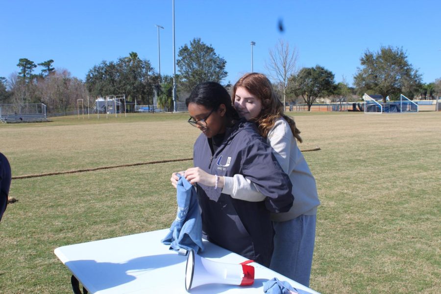 SGA members, seniors Keten Abebe and Vivian Loud participate in a game during the field day they hosted for ESE students. 
