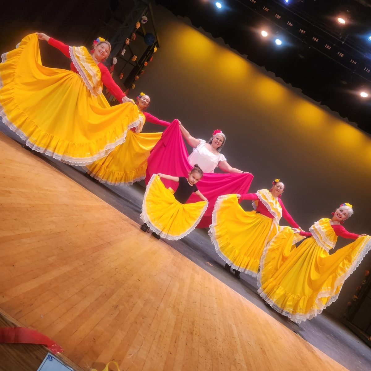 Ms. Rosa Davila participates in a traditional Venezuelan dance during the Hispanic Festival. 