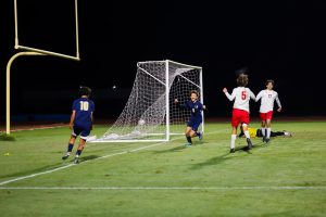 Junior Ethan Fowler celebrates a goal against East River High School.
