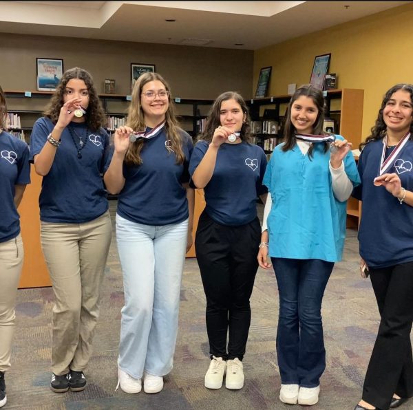 HOSA students present their medals following competition.