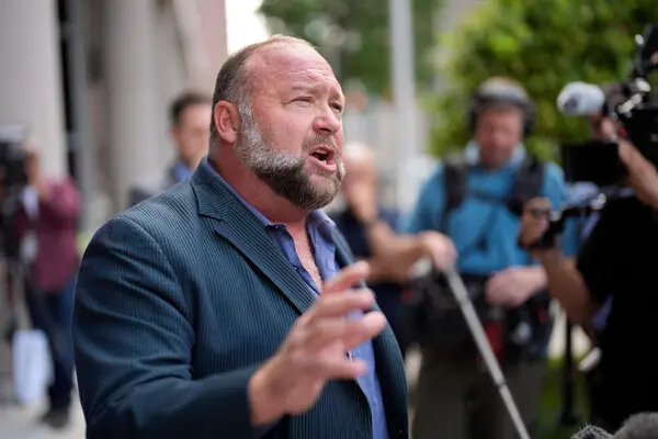 Jones pictured speaking to reporters outside a federal courthouse in Houston.