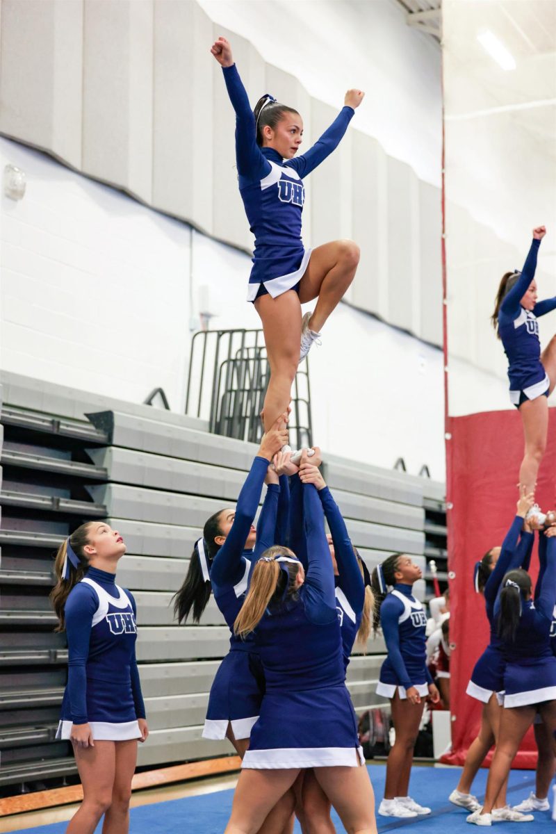 Varsity cheer team preparing for their impending State Championship competition.