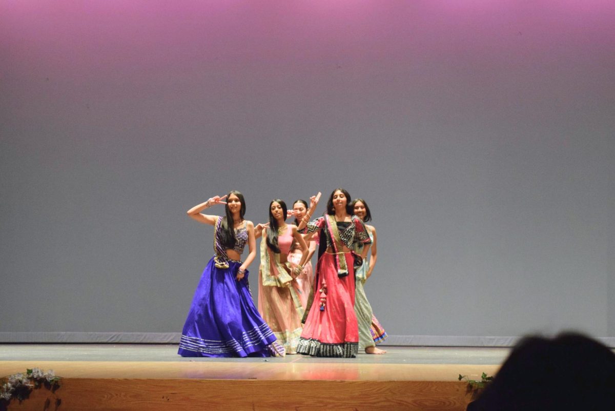 Members of the UHS Bollywood team perform a traditional dance.