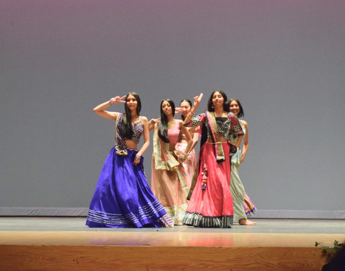 Members of the UHS Bollywood team perform a traditional dance.