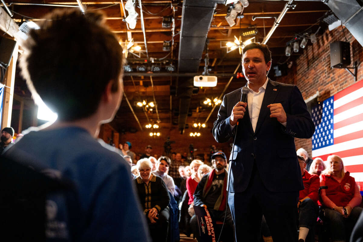 DeSantis pictured speaking to a child during one of his New Hampshire campaign rallies at the start of this year.