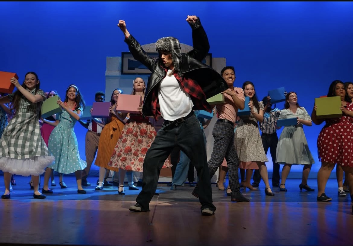 Students pictured performing dance rendition of "Blue Suede Shoes."