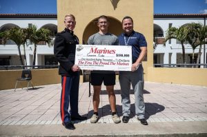 Cote pictured with his $180,000 scholarship check.