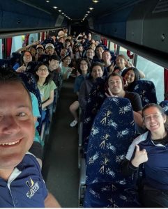 Principal Ott photographs himself with a bus of Grad Bash attendees.