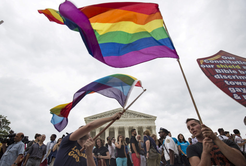 Supporters of same-sex marriage flying the pride flag outside of the U.S Supreme Court.