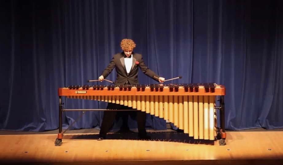 Zachary Lau during his solo playing a percussion instrument called the marimba. 